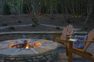 fire pit with two chairs around it