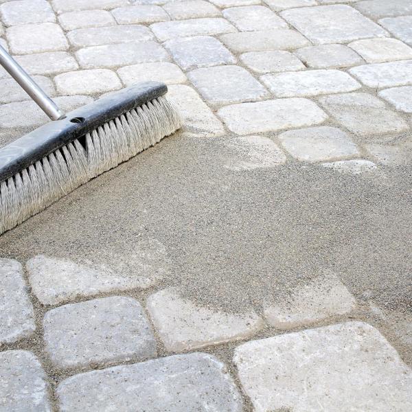 Paver sand being applied