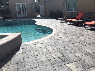 pavers vs travertine pool deck