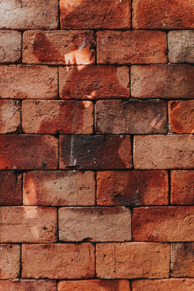 It's possible to remove wood stain from brick.