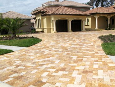 Pavers Go With a Yellow House